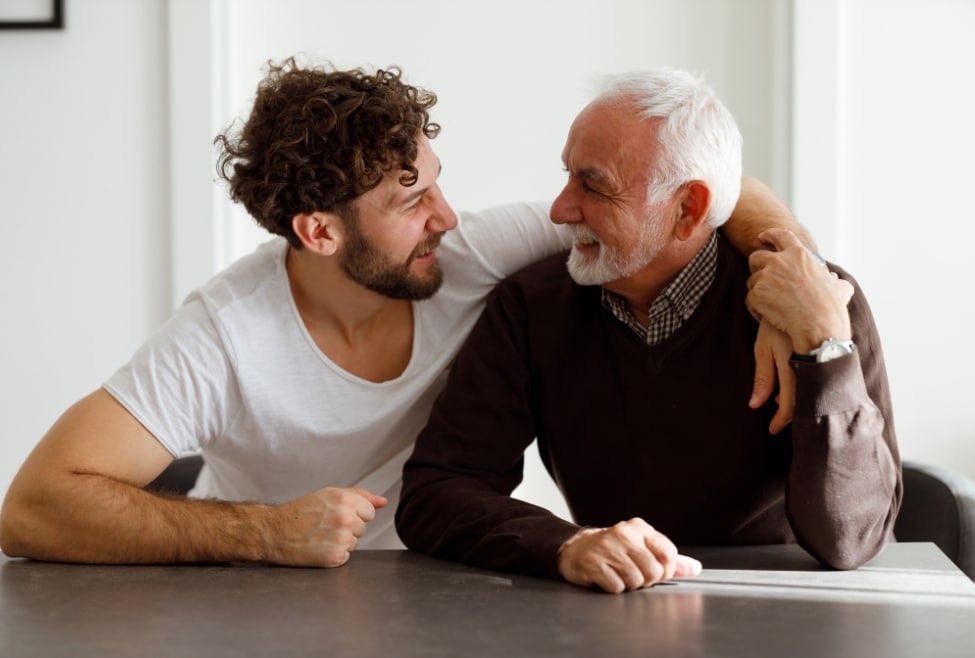 Father and son smiling, celebrating Father's Day with warmth and joy, embracing each other happily, representing the gift of comfort and HVAC services from Arctic Air. Keywords: Father's Day gift, HVAC services, Comfortable home, Arctic Air, HVAC system upgrade, Indoor air quality improvement, Smart thermostat installation, Duct cleaning services, HVAC maintenance check, Reliable heating and cooling, AC repair near me, Furnace repair near me, AC installation near me, Furnace installation near me, AC repair Palmdale, AC repair Lancaster, AC repair Quartz Hill, AC repair Rosamond, AC repair Acton, AC repair Tehachapi, AC repair Pearblossom, AC repair Littlerock, AC repair Mojave.