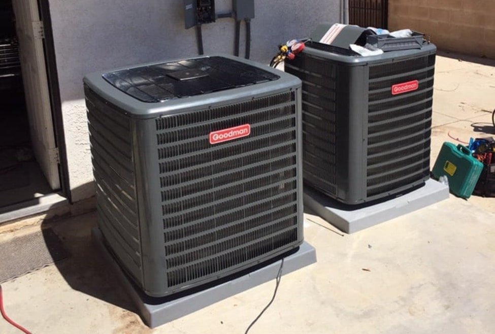 Two HVAC systems for heating and cooling outside a residential home, representing Arctic Air's 2022 fall HVAC maintenance checklist, offering expert HVAC services like heating tune-ups, AC inspections, and system maintenance in Palmdale, Rosamond, Lancaster, Acton, Mojave, and Tehachapi. Call us for expert help with 2022 fall HVAC maintenance checklist, fall HVAC system maintenance, HVAC maintenance checklist, fall furnace tune-up, HVAC inspection checklist, heating maintenance in Palmdale, fall air conditioning service, HVAC maintenance services near me, fall heating and cooling maintenance, fall HVAC tune-up, furnace maintenance in Rosamond, HVAC repair services, heating system maintenance checklist, air conditioning maintenance services, HVAC filter replacement, seasonal HVAC maintenance, air conditioner maintenance in Lancaster, heating repair in Acton, professional HVAC tune-up, fall maintenance for HVAC units, expert HVAC maintenance services near me, routine HVAC service for fall, complete HVAC inspection, affordable HVAC maintenance in Mojave, fall furnace service in Tehachapi.